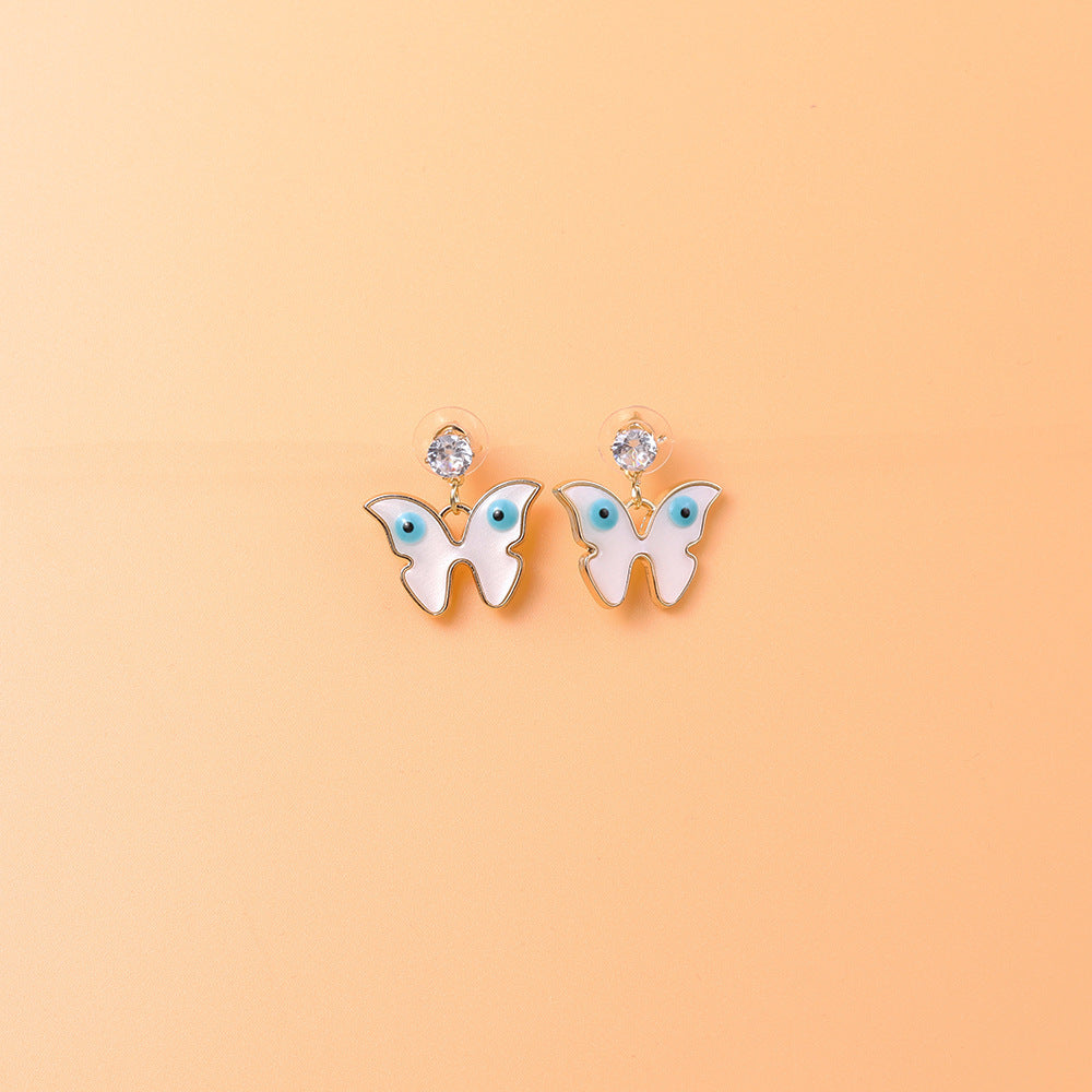 Venta al por mayor Pendientes de la aleación de la mariposa de la palma de la luna del ojo del diablo